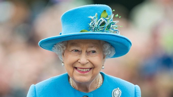 Queen Elizabeth II in Blue Hat and blue jacket with a beautiful smile